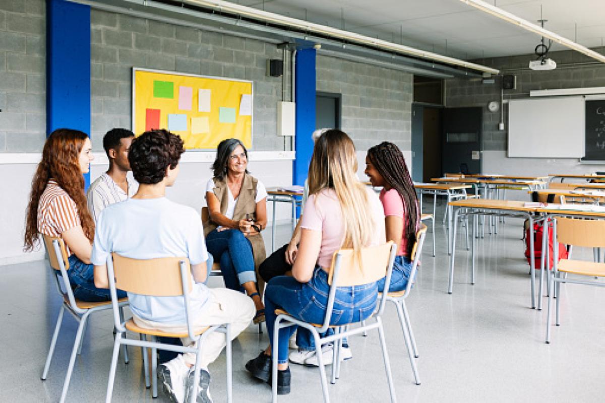 People sitting in chairs in a circle